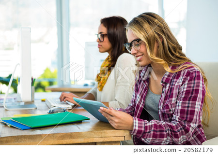 Two girls work at office 20582179