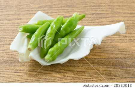 Fresh Green Chili Pepper on A White Cabbage Leaf Fresh Green Chili Pepper on A White Cabbage Leaf 20583018