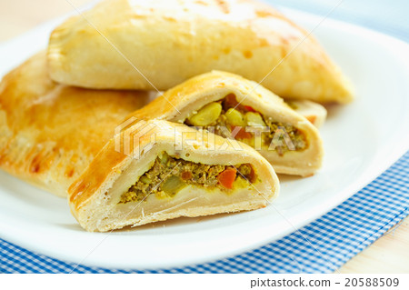 Tasty cake stuffed with meat on a white plate Tasty cake stuffed with meat on a white plate 20588509
