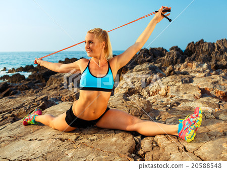 Athlete woman doing sport exercising with the rope Athlete woman doing sport exercising with the rope 20588548