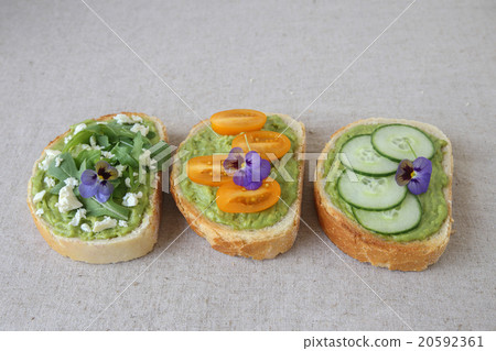Mixed green sourdough open face sandwiches toast 20592361