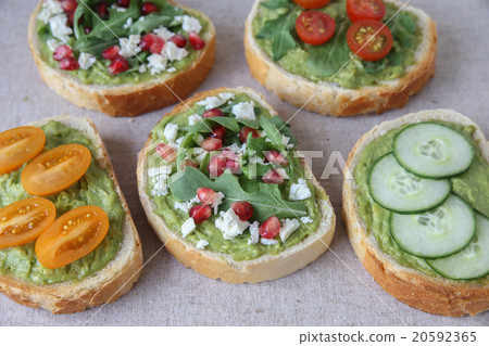 Mixed green sourdough open face sandwiches toast 20592365