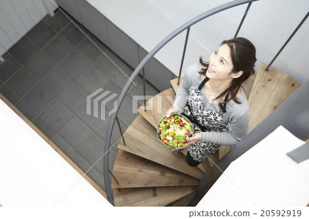 A woman carrying food 20592919