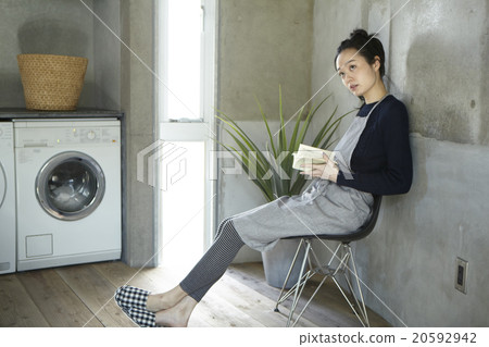 A woman reading a book 20592942