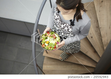 A woman carrying food A woman carrying food 20592943