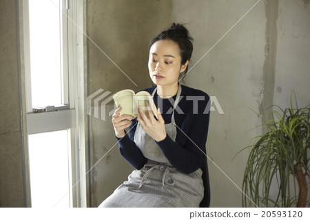 A woman reading a book 20593120