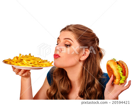 Girl eating big sandwich. 20594421