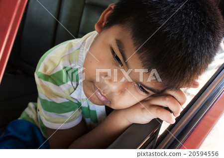 boy sad alone in the old car 20594556