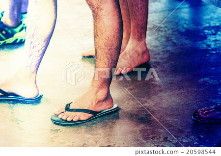 Men's feet wearing sandals 20598544