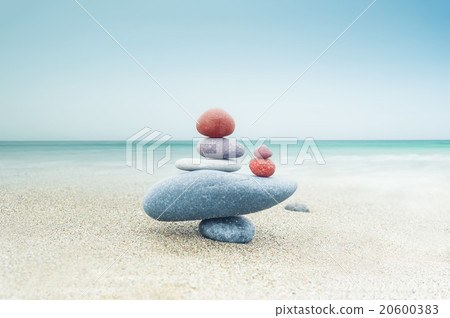 Balancing zen stones pyramid on sand 20600383