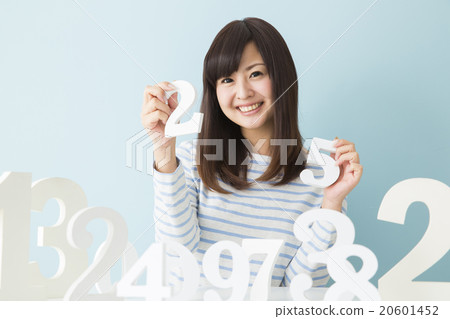 A young lady choosing a number A young lady choosing a number 20601452