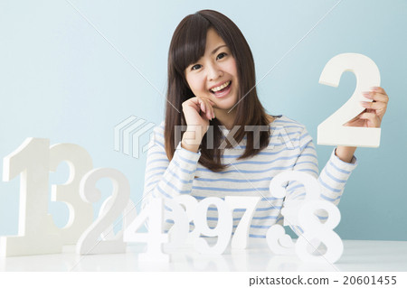 A young lady choosing a number A young lady choosing a number 20601455