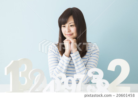 A young lady choosing a number A young lady choosing a number 20601458
