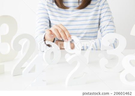 A young lady choosing a number A young lady choosing a number 20601462