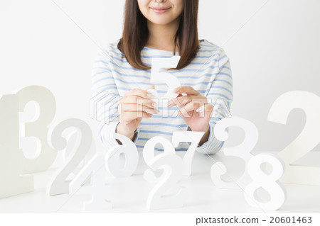 A young lady choosing a number A young lady choosing a number 20601463