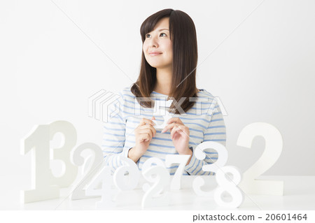 A young lady choosing a number A young lady choosing a number 20601464