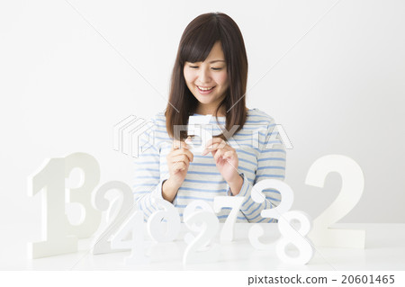 A young lady choosing a number A young lady choosing a number 20601465