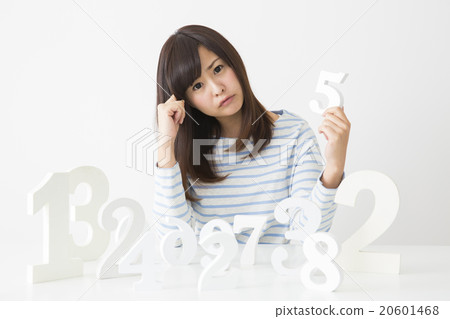A young lady choosing a number A young lady choosing a number 20601468