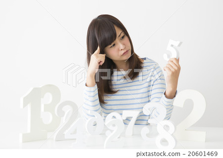 A young lady choosing a number A young lady choosing a number 20601469