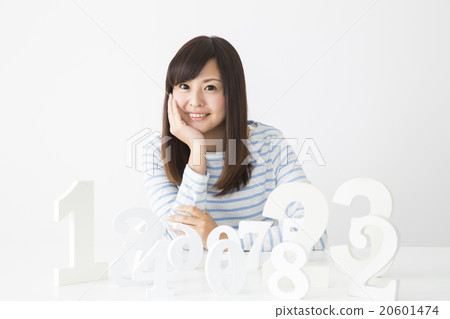A young lady choosing a number A young lady choosing a number 20601474