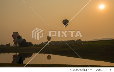 Silhouette hot air balloon over river Silhouette hot air balloon over river 20602403