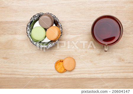 Set colorful macaroons and glass cup of black tea Set colorful macaroons and glass cup of black tea 20604147