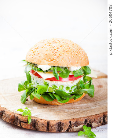 Vegetarian burger with egg, pea patty, fresh salad 20604708