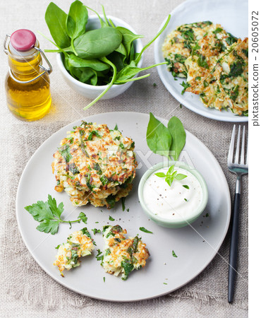 Cabbage and spinach pancakes with yogurt dressing Cabbage and spinach pancakes with yogurt dressing 20605072