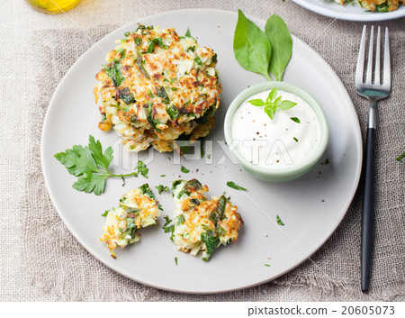 Cabbage and spinach pancakes with yogurt dressing Cabbage and spinach pancakes with yogurt dressing 20605073