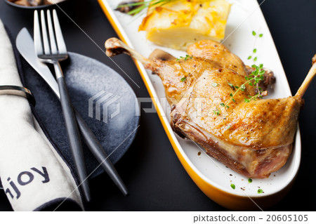 Duck legs confit, potato gratin and mushroom sauce Duck legs confit, potato gratin and mushroom sauce 20605105