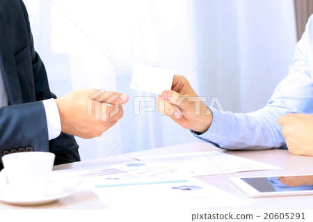 Two businessman exchanging  business card 20605291
