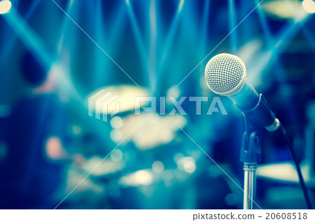 Close up of microphone on musician blurred background Close up of microphone on musician blurred background 20608518