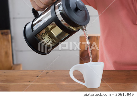 Man pouring tea with white cup 20613949