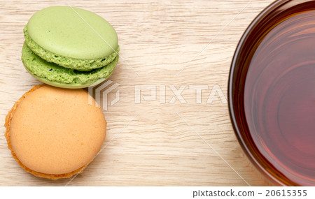 Macaroons and glass cup of black tea Macaroons and glass cup of black tea 20615355