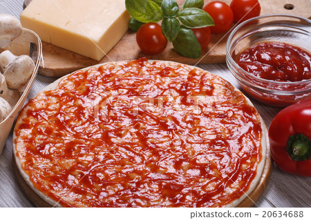 Basis for pizza with tomato sauce and ingredients 20634688