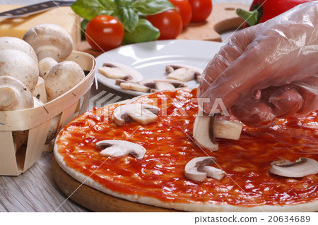 Preparation of mushroom pizza closeup Preparation of mushroom pizza closeup 20634689