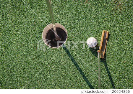 Putter with golf ball and hole 20634896