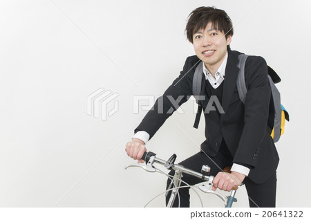 A businessman going to work by bicycle 20641322
