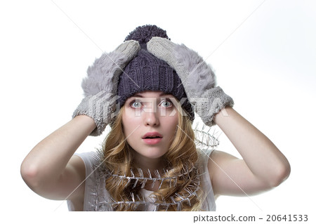 Beautiful  girl in winter hat on white background 20641533