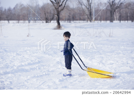 Children playing with snow Children playing with snow 20642994
