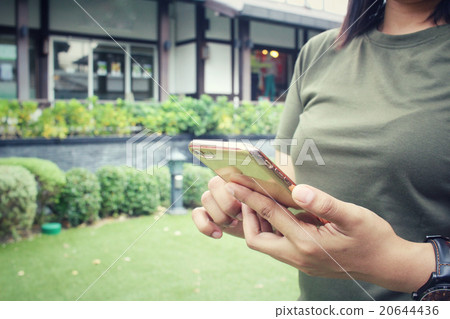 Woman using smart phone Woman using smart phone 20644436