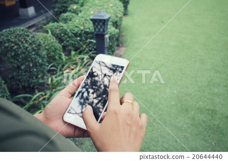 Woman using smart phone Woman using smart phone 20644440