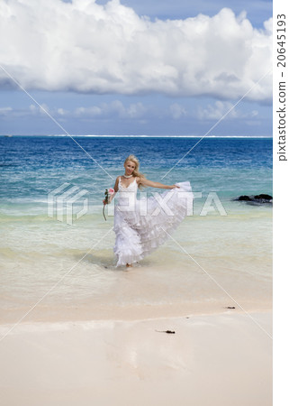 woman in a wedding dress runs on waves of the sea woman in a wedding dress runs on waves of the sea 20645193