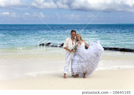 groom and the bride on the tropical beach. groom and the bride on the tropical beach. 20645195