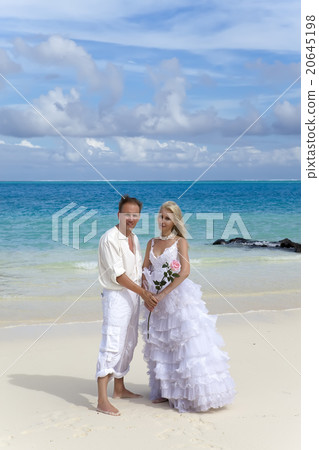 groom and the bride on the tropical beach. groom and the bride on the tropical beach. 20645198
