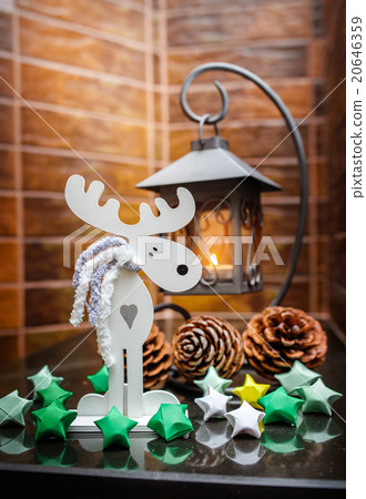 Metal candlestick cones and toys on mantelpiece Metal candlestick cones and toys on mantelpiece 20646359