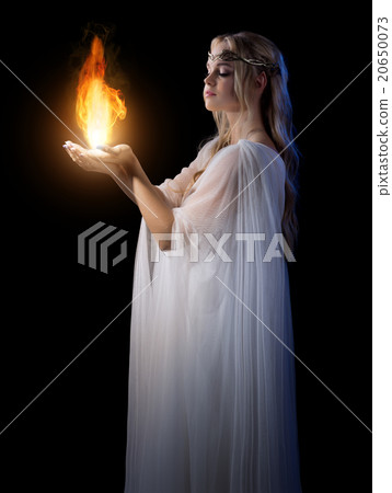 Young elven girl holding fire in palms 20650073