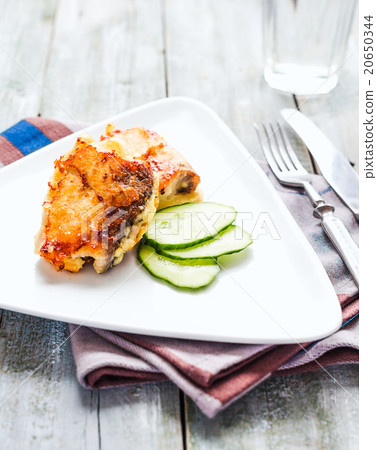 fried mackerel, fish in batter with fresh cucumber 20650344