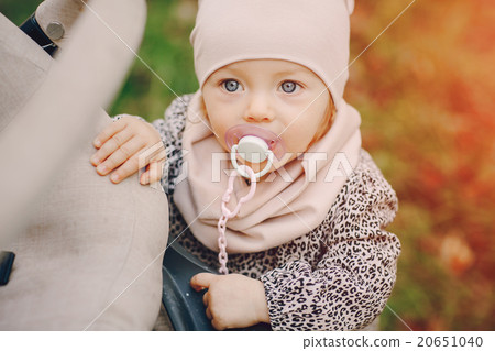 young family walking in the park 20651040