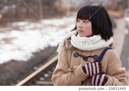Girls junior high school students going to school by train 20651440